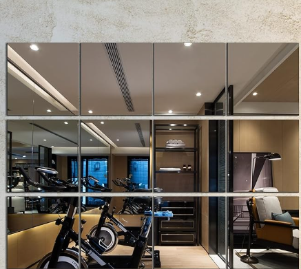 DIY mirror tiles for home gym wall