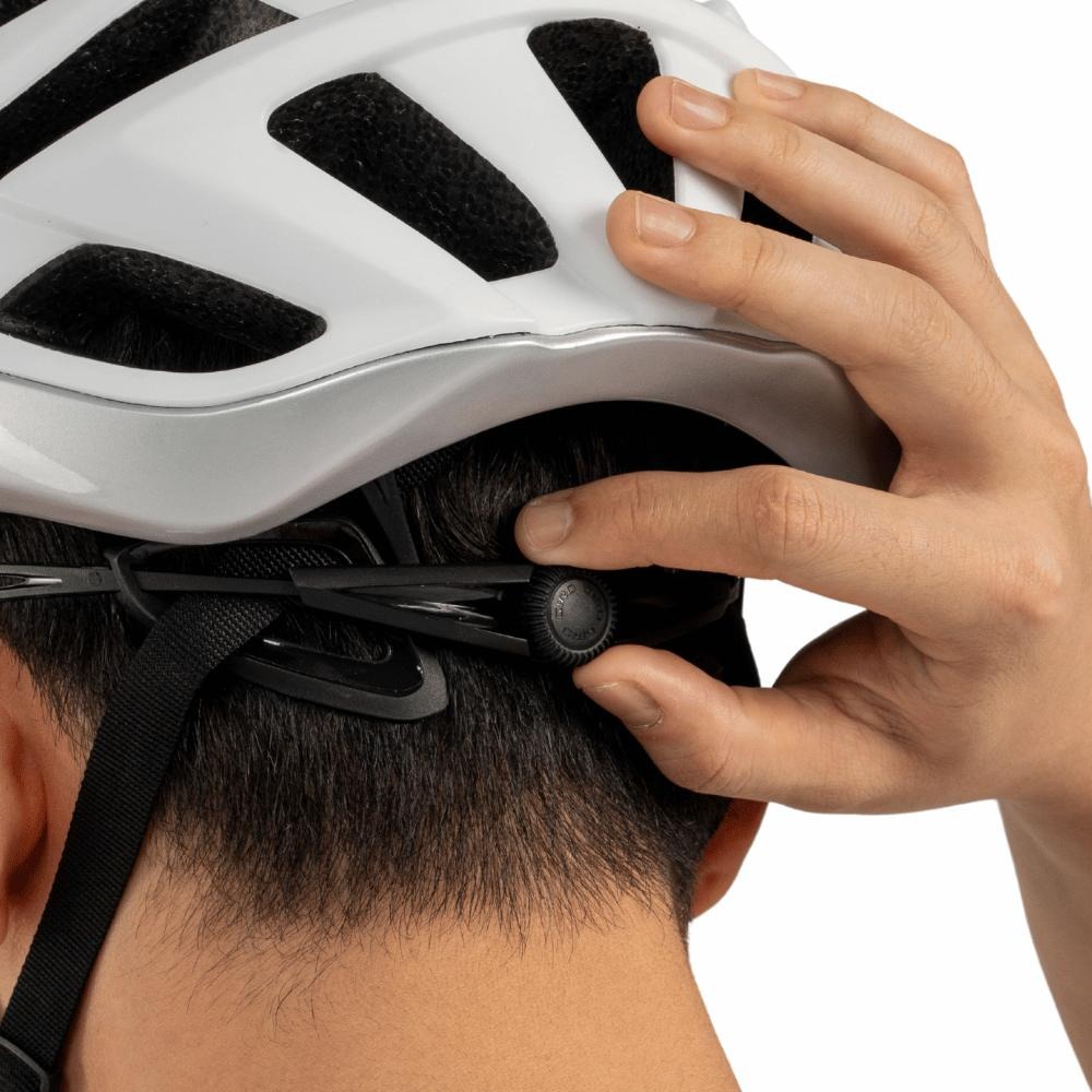Rear dial adjustment mechanism on an adult bicycle helmet.