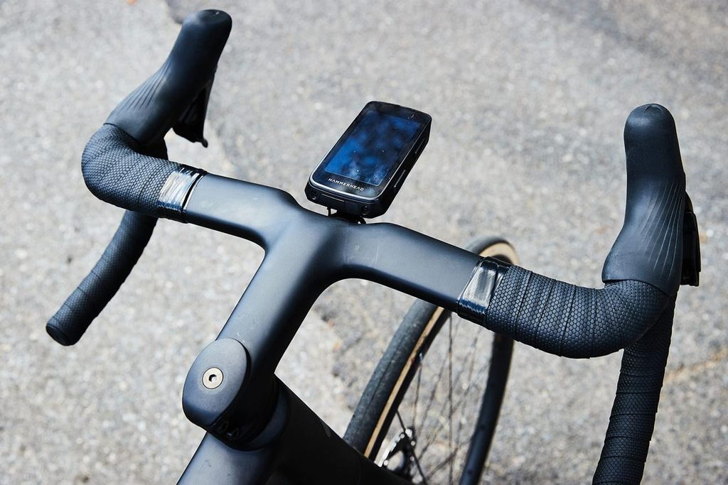Compact bicycle cockpit showing a smartphone mounted near the stem for navigation.